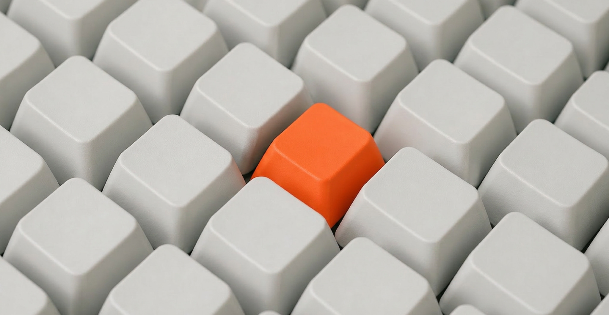A single orange keycap standing out in a grid of identical white keycaps, representing AI governance bringing order to scattered AI experiments