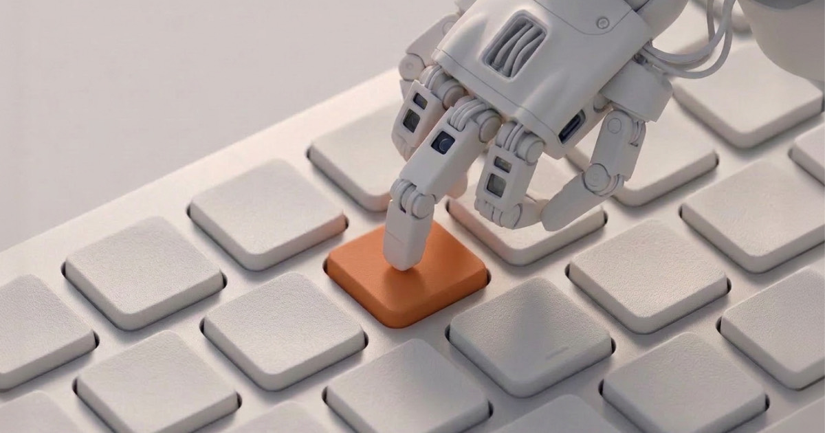 A white robotic hand pressing a single orange key on a white keyboard, representing AI-assisted engineering intelligence