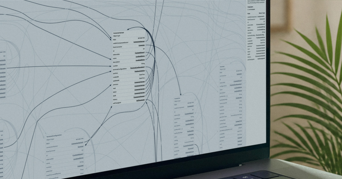 A laptop screen showing an engineering knowledge graph: component and variant schema tables connected by curved relationship edges