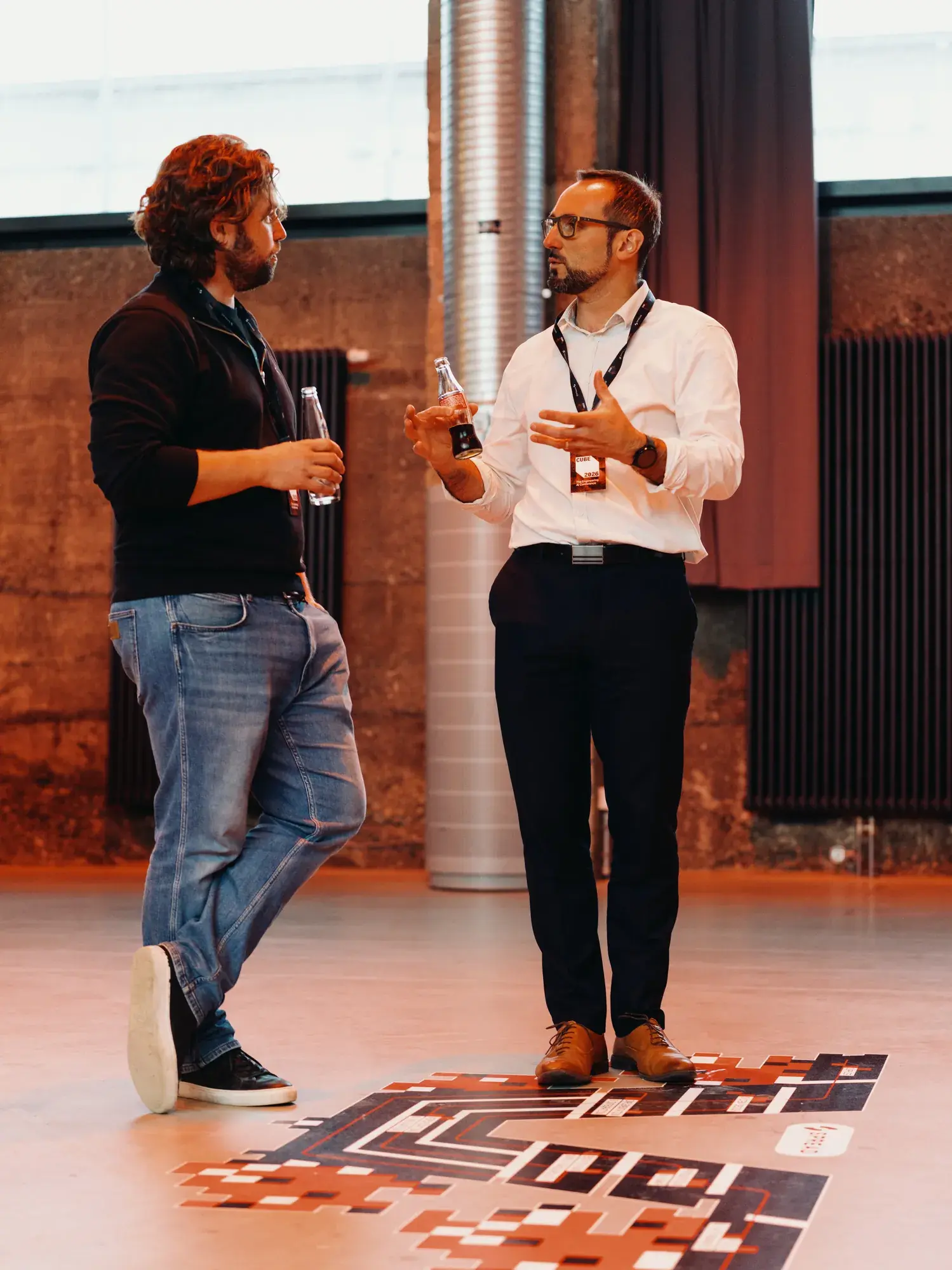 Two speakers on stage at CUBE 2026