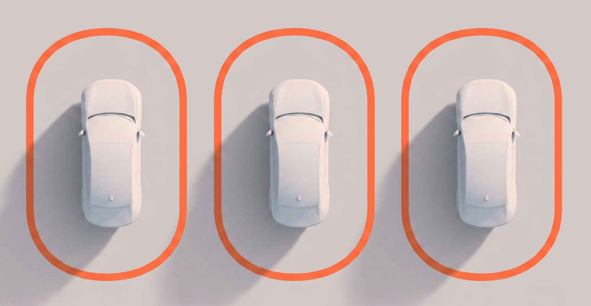 Three top-down white cars framed by orange outlines, representing software-defined vehicle development